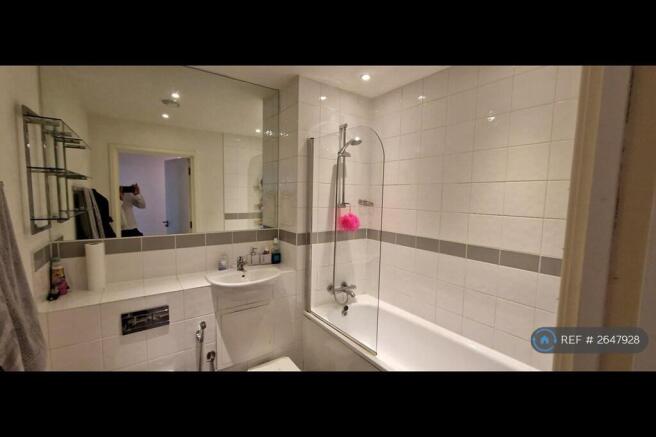 Bathroom With Large Mirror 