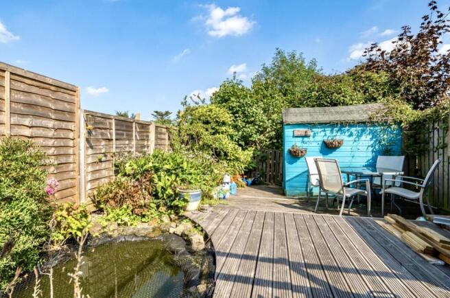 Lower Decked Area With Pond And Water Cascade
