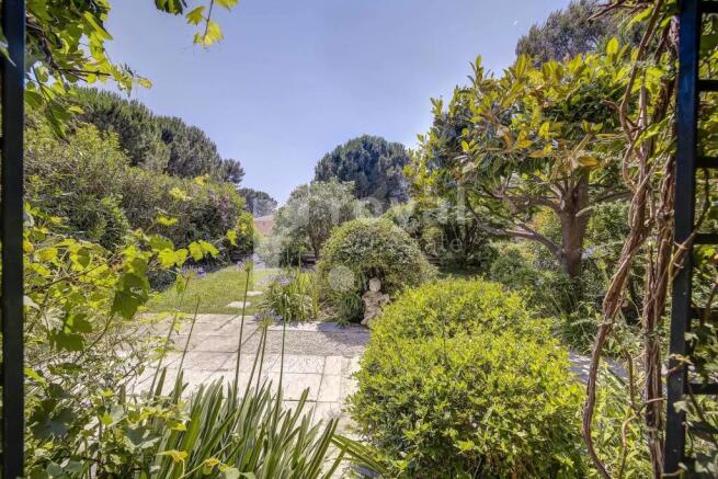 Sunny terrace and cozy garden of a prestigious apa