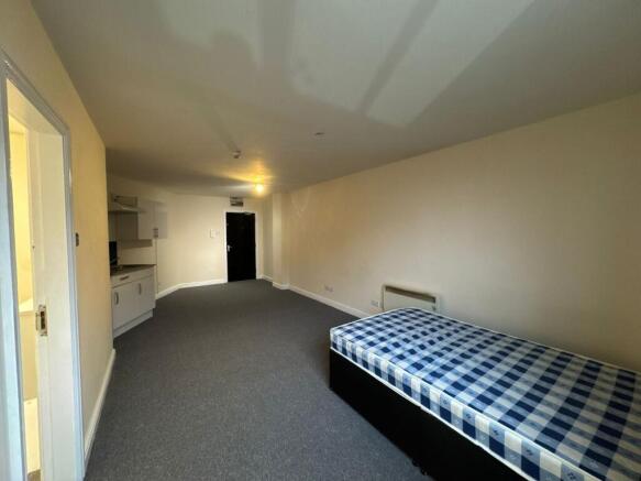 Spacious living area featuring a large open spa...