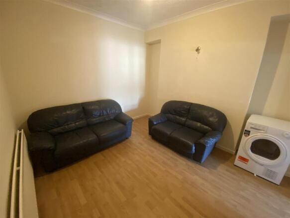 Comfy leather sofas in a clean living space....