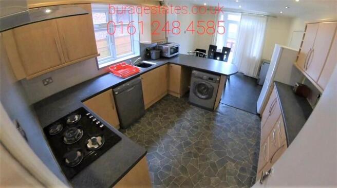 Bright and well-maintained kitchen with ample c...