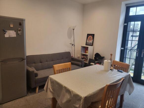 Bright, neatly presented living/dining area wit...