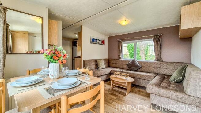 Open plan lounge and dining area inside the Delta