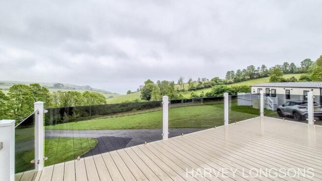Decking area with glass balustrade and open countr