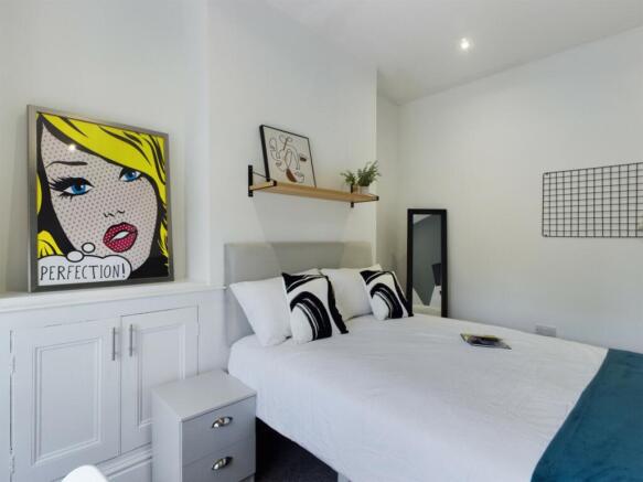 A stylish and inviting double bedroom featuring...