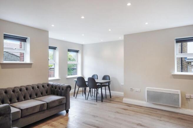 Bright, modern living area with stylish seating...