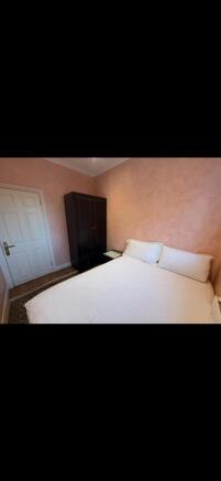 Bright bedroom with double bed and wardrobe...