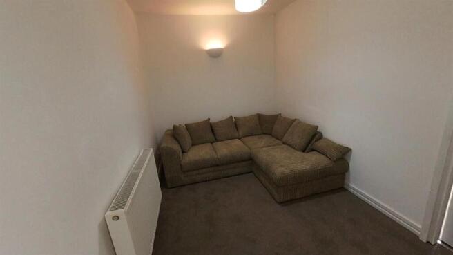 Cozy lounge area with a comfortable corner sofa...