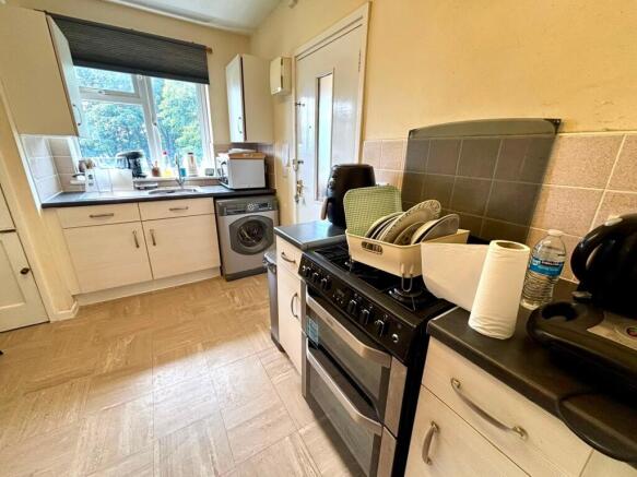 Bright kitchen with ample workspace and storage...