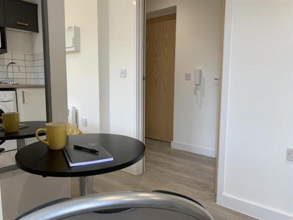 Bright, modern hallway with contemporary floori...