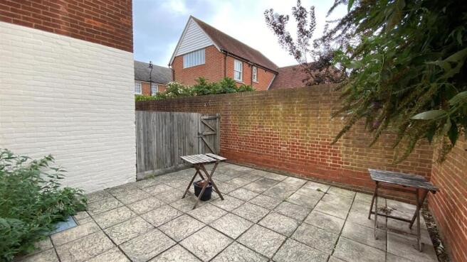 Private paved patio area for outdoor relaxation...
