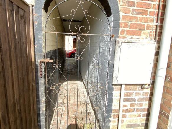 Side entry to rear garden serving properties