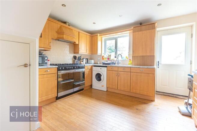 Bright and functional kitchen featuring ample w...