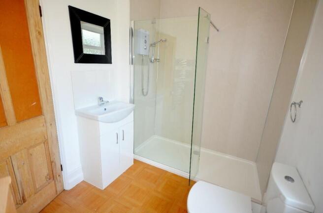 Bright and modern bathroom suite featuring a sp...