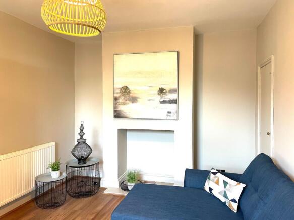 A bright and stylish living room featuring a mo...