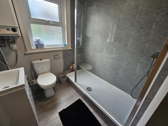 Modern bathroom with a full-size shower-bath, c...