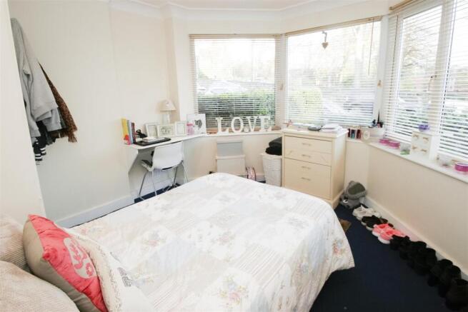 Bright and tidy bedroom with large windows prov...
