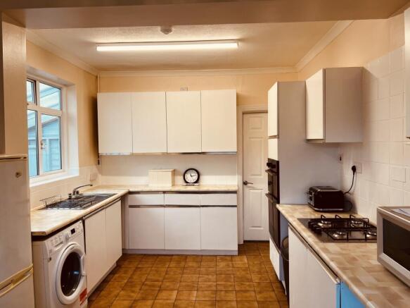 Bright, well-kept kitchen with generous counter...