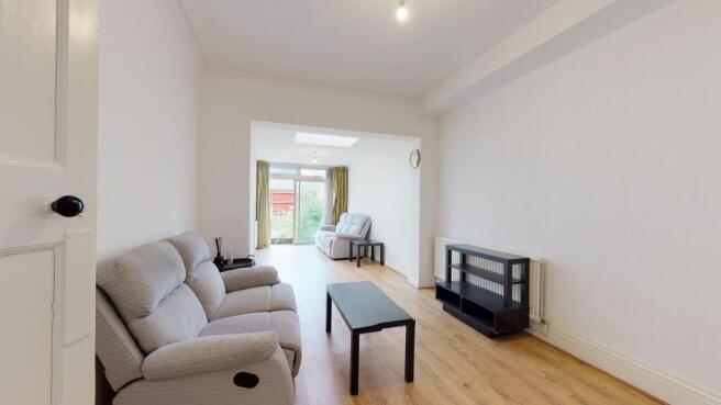 Spacious contemporary living room with garden v...