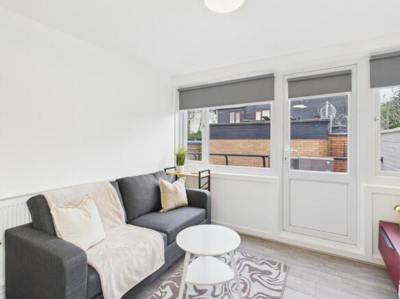 Bright, modern living room with a comfortable d...