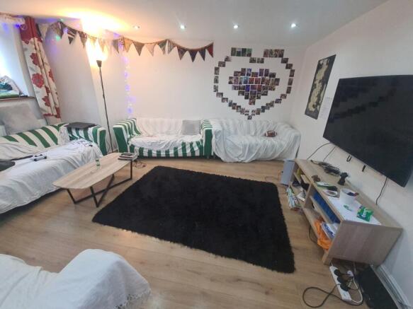 A cozy and inviting living room featuring multi...