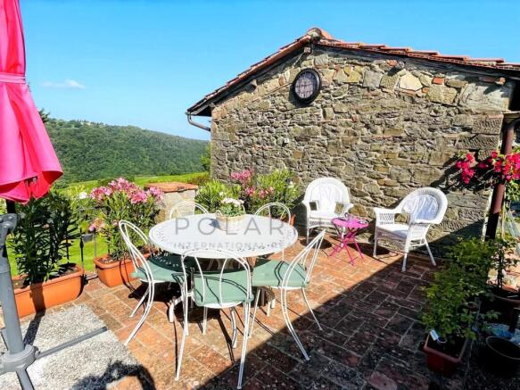 Charming outdoor terrace with garden views, ideal