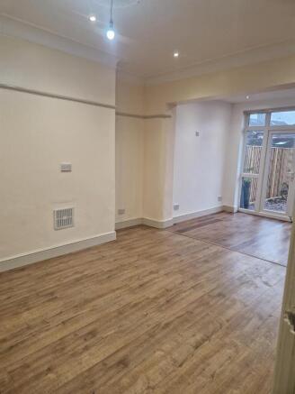 Bright and spacious lounge with wood flooring...