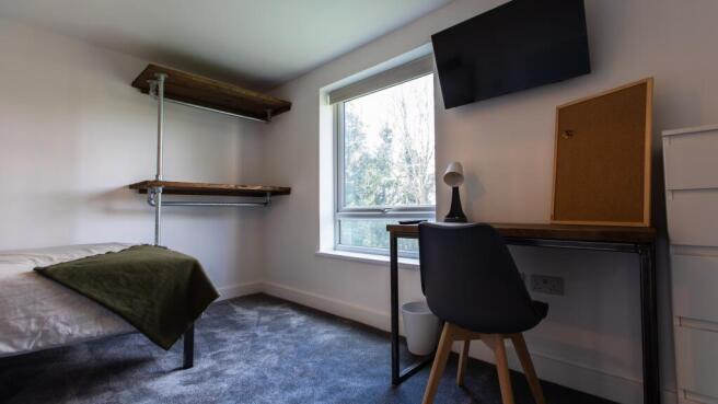 Bright, modern single bedroom with a study area...