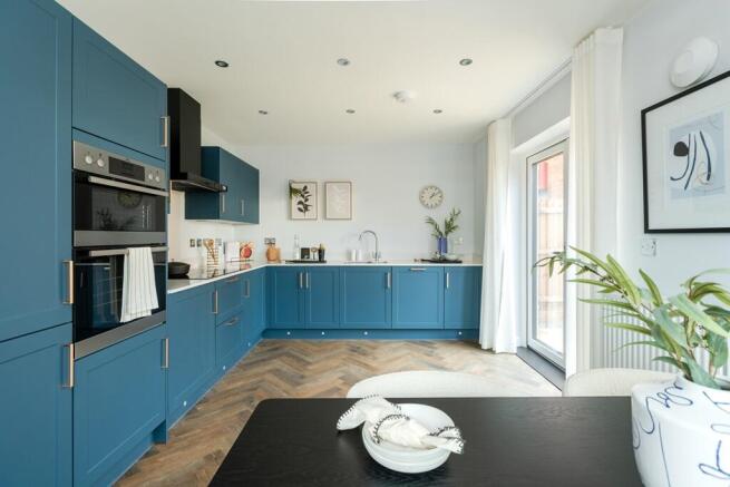 A stylish kitchen diner with double doors to the garden