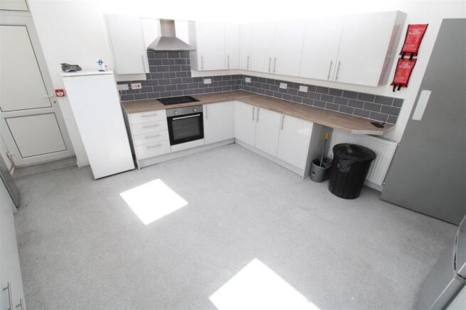 Bright and spacious kitchen with sleek cabinets...