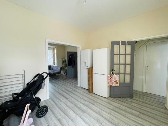 Bright, clean kitchen area with light wood-effe...