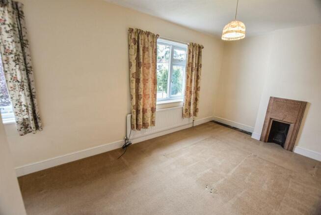 12 The Village - bedroom 1 (brochure).jpg