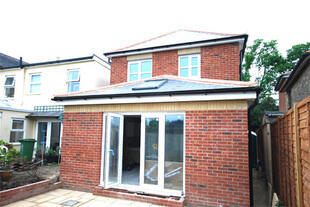 Rear of House With Patio Doors