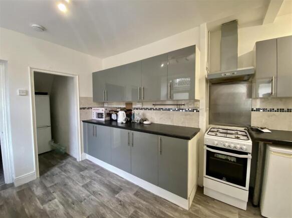 Modern kitchen with stylish grey gloss cabinets...