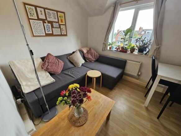 Bright and welcoming living room featuring comf...