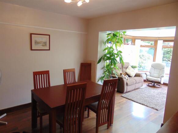DINING ROOM OPENING TO CONSERVATORY