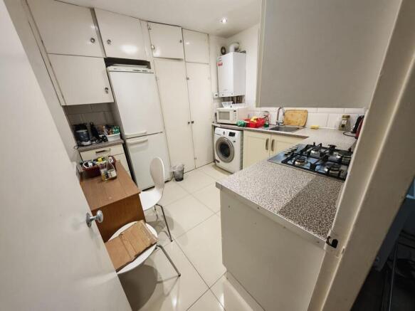 Fully equipped kitchen with ample storage space...