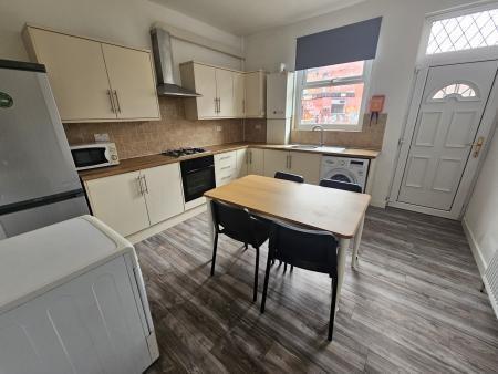 Bright and modern kitchen featuring a spacious ...