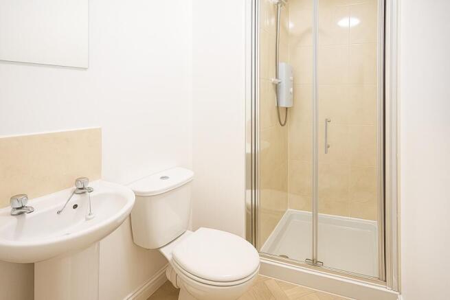 Bright, modern bathroom with a clean white sink...