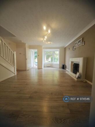 Living Room With Fireplace & Laminate Floor