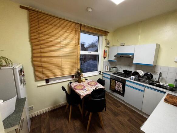 Bright, functional kitchen with integrated appl...