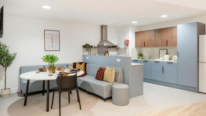 Bright, modern open-plan kitchen and dining are...