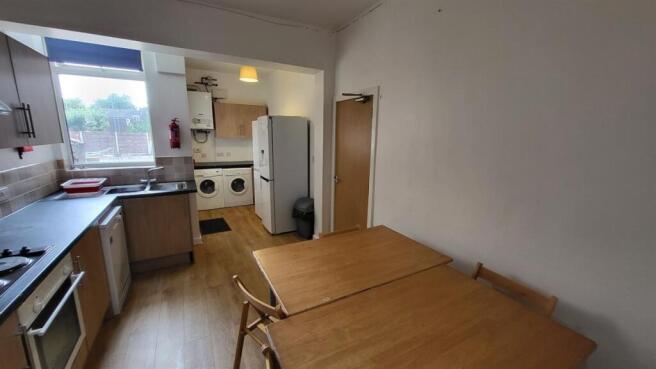 Bright, practical kitchen with built-in applian...