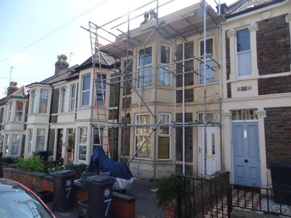 Terraced two-storey house frontage with bay win...