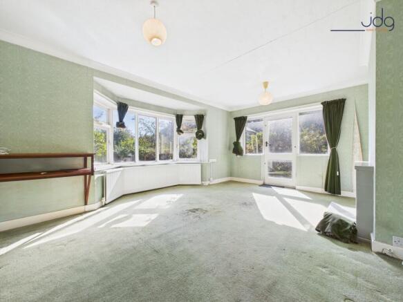 Living Room with bay windows, fireplace and access to the garden