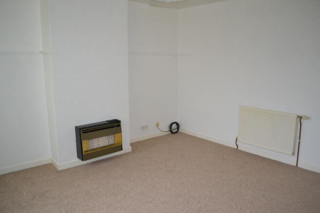 Living Room With Large Window Overlooking Rear