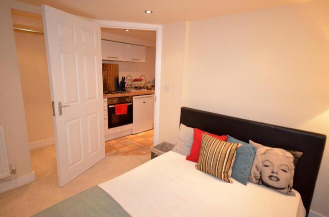 A cozy and well-maintained double bedroom featu...