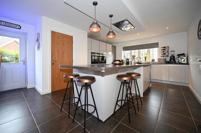 Living kitchen with bifolding doors into gardens