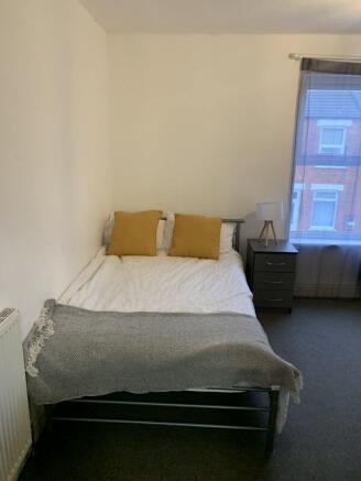 Bright bedroom with stylish yellow accents...